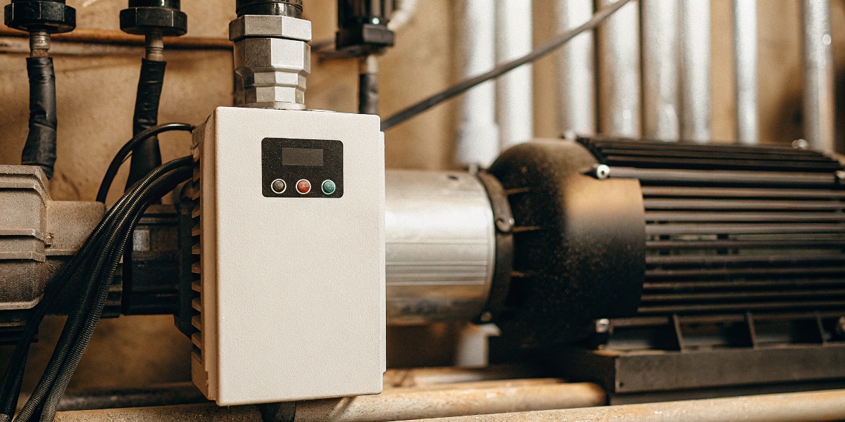Hybrid Inverter as VFD A hybrid inverter unit with digital display shown next to an industrial motor